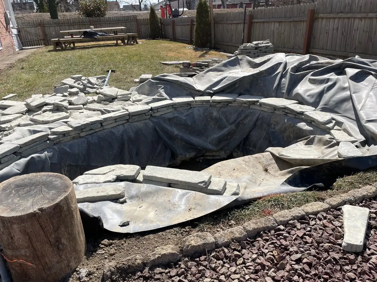 Pondless waterfall reservoir and stonework during construction
