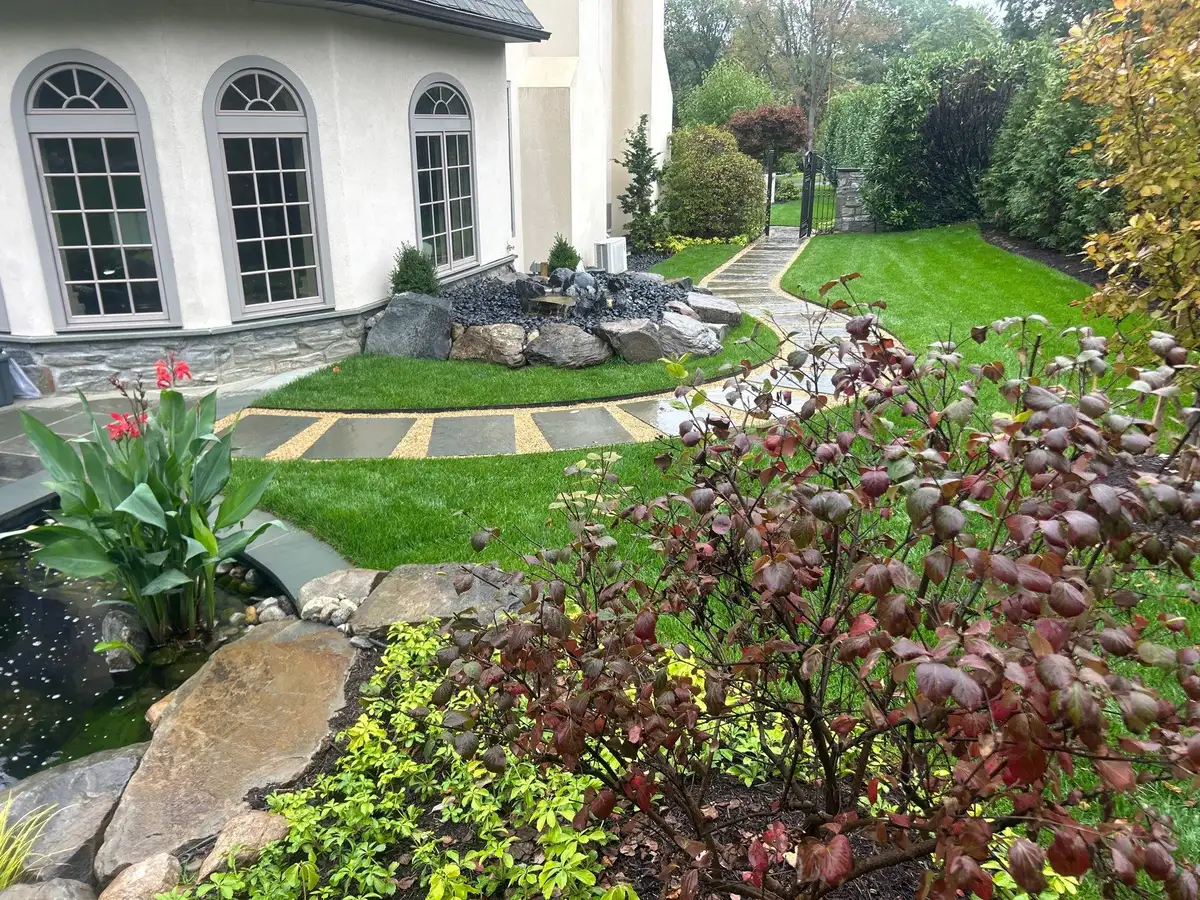 Natural backyard water feature in a wooded setting