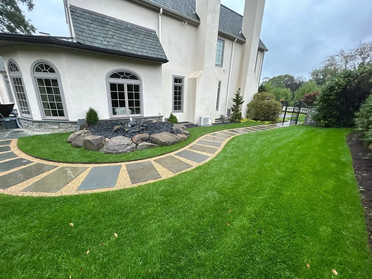 Backyard pond installation in a suburban property setting
