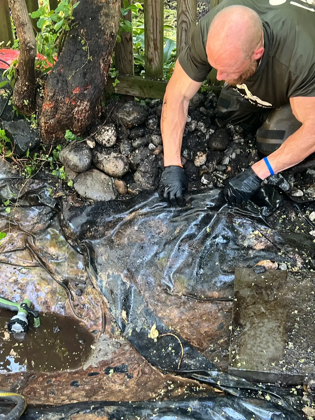 Water level inspection during pond leak diagnostic assessment in Delaware