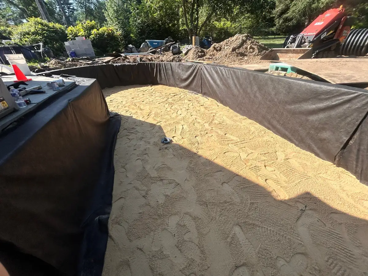 Large pond construction with natural boulder layout