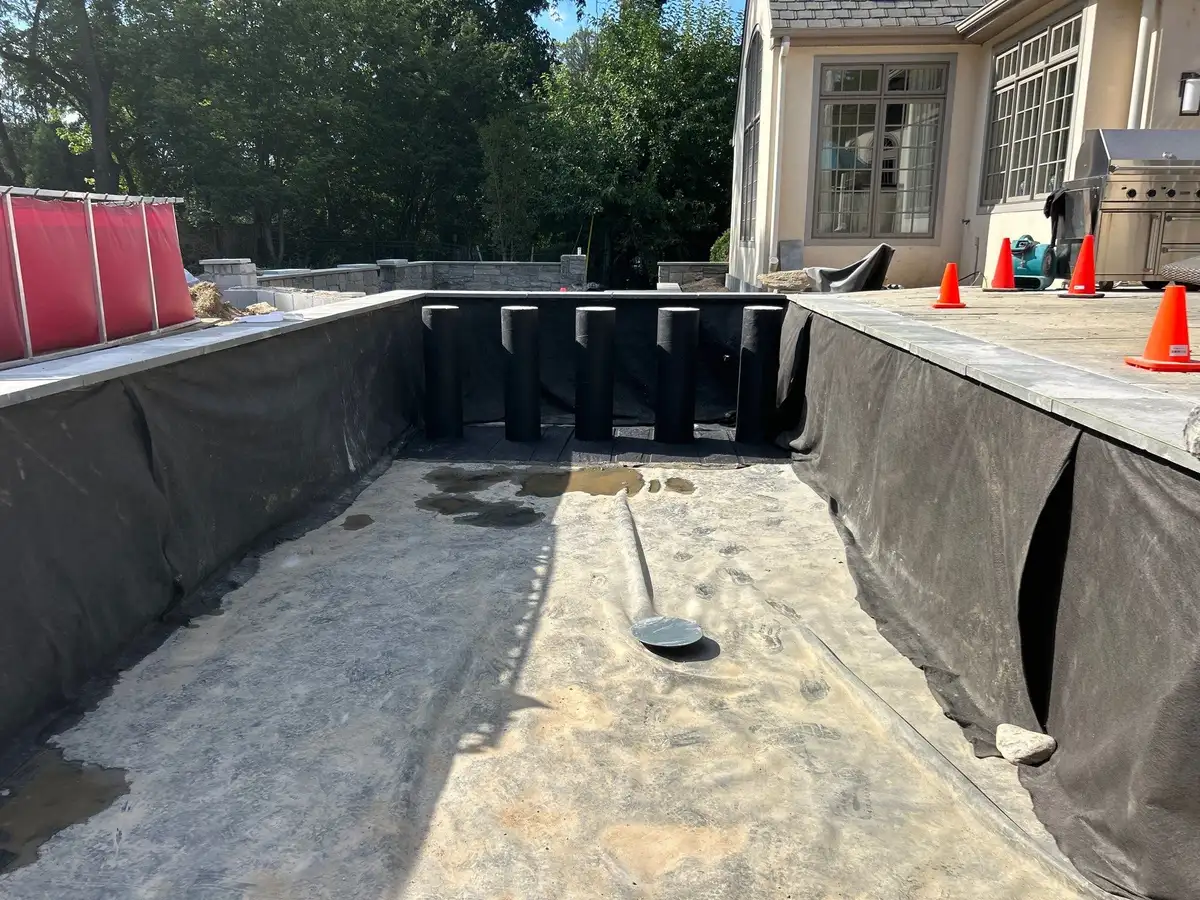 Clean maintained backyard pond with stone edge and healthy water movement
