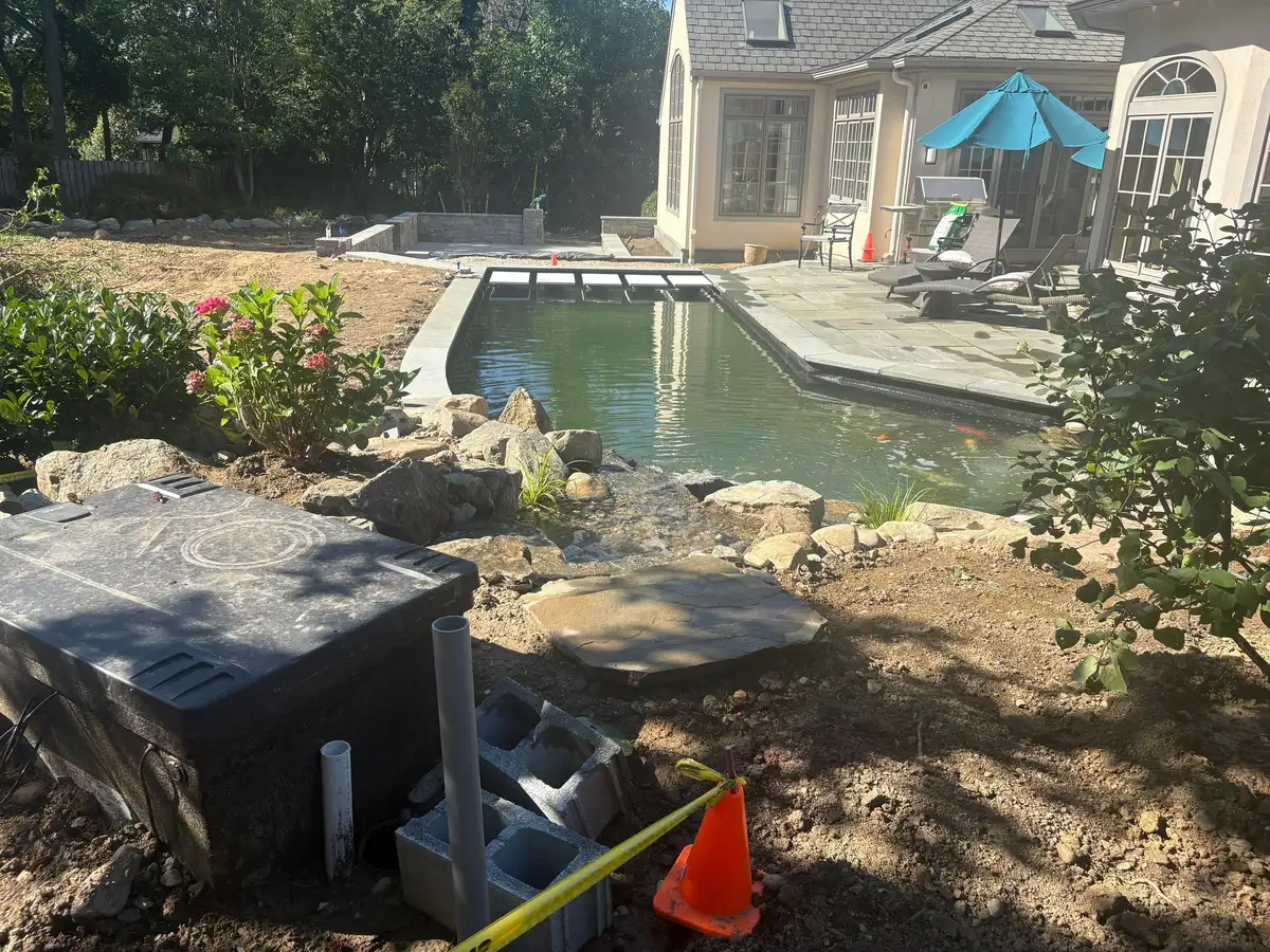 Technician testing green pond water before treatment