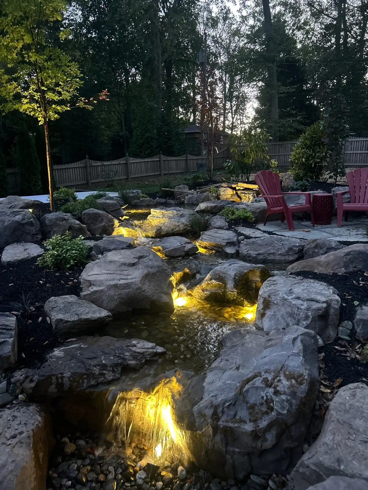 Natural stone waterfall and cascading water